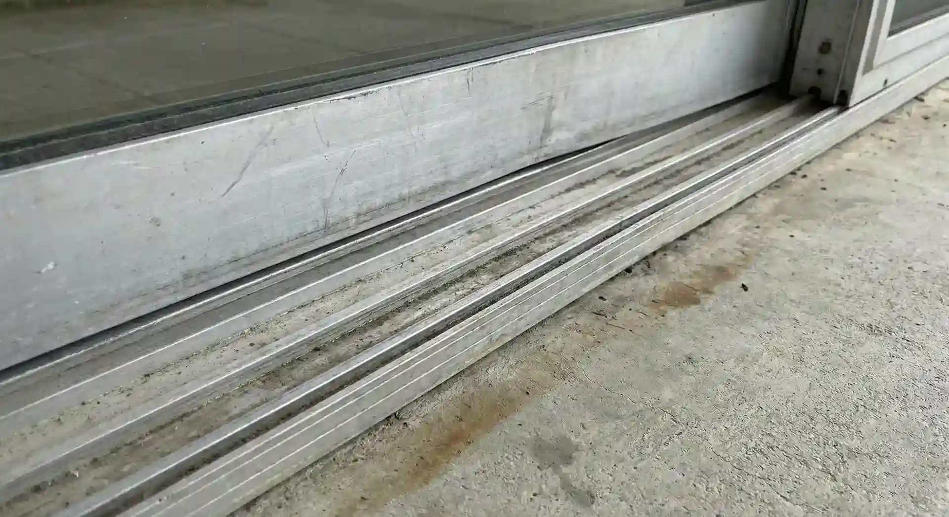 A Misaligned Sliding Door a track - Before fixing