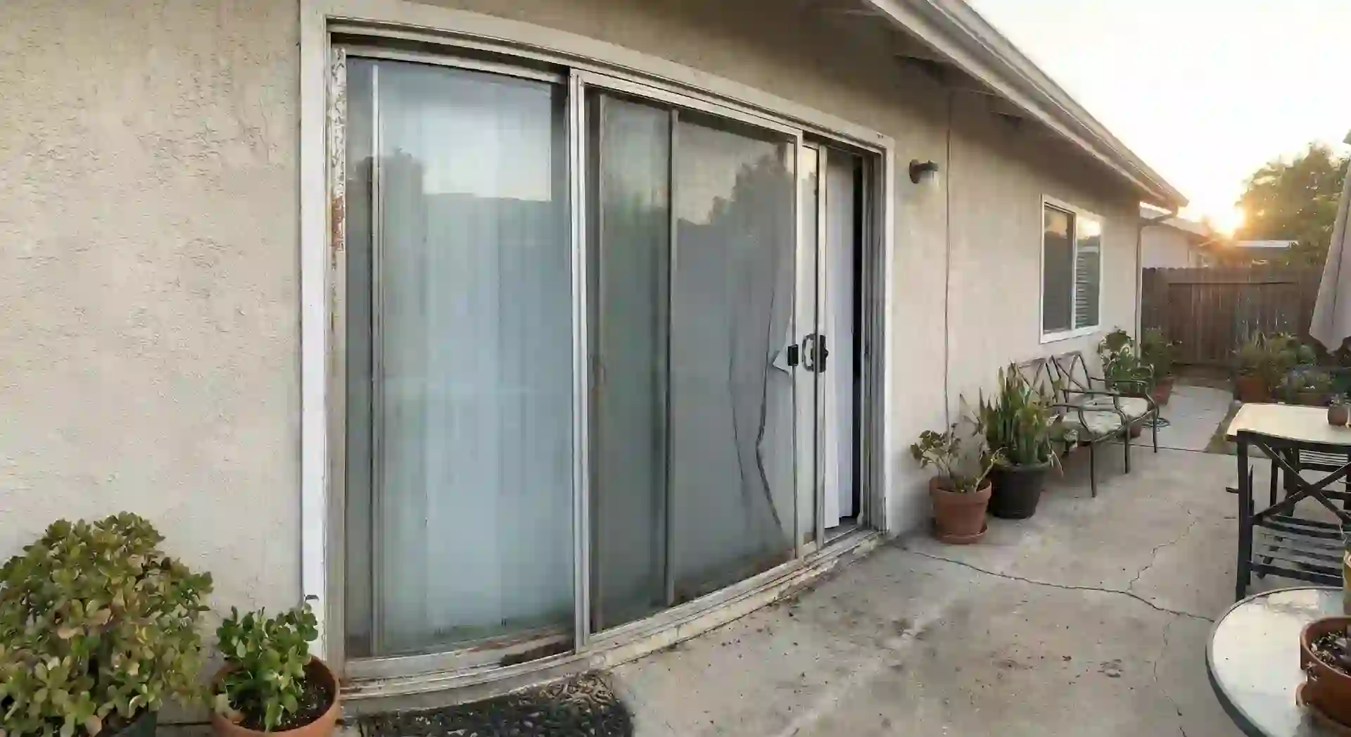 Old Sliding Door and Screen Door Needing Repair in Phoenix - Before